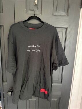 CHNGE Black Short-Sleeve Graphic Tee with White Text and Red Patch